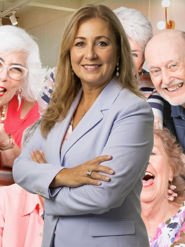Frieda Negrón with smiling clients at a community event